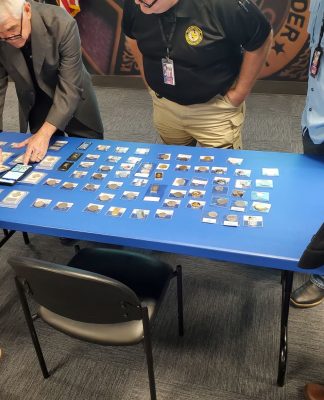 Doug Davis setting up counterfeits display